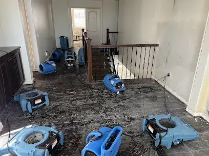 Air movers drying a stripped floor after water damage in Canoga Park