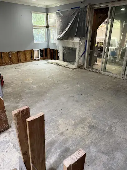 Room with wet flooring removed and walls opened for drying in Canoga Park