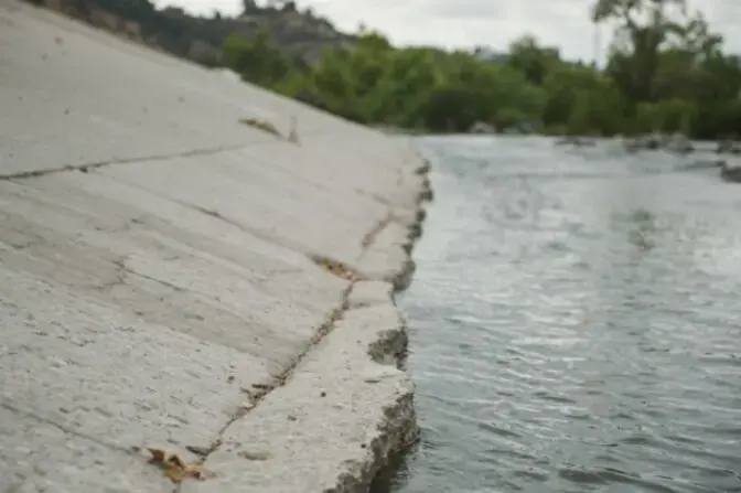 Water running in a concrete flood-control channel of the Los Angeles River