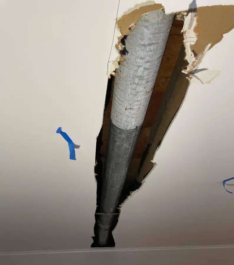 Ceiling opened around an AC duct after a condensate leak in Canoga Park