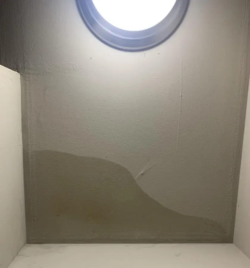 Water stain running down the wall of a skylight well after a roof leak in Canoga Park