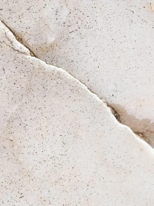 Crack running across a concrete slab floor where a slab leak can surface in Canoga Park
